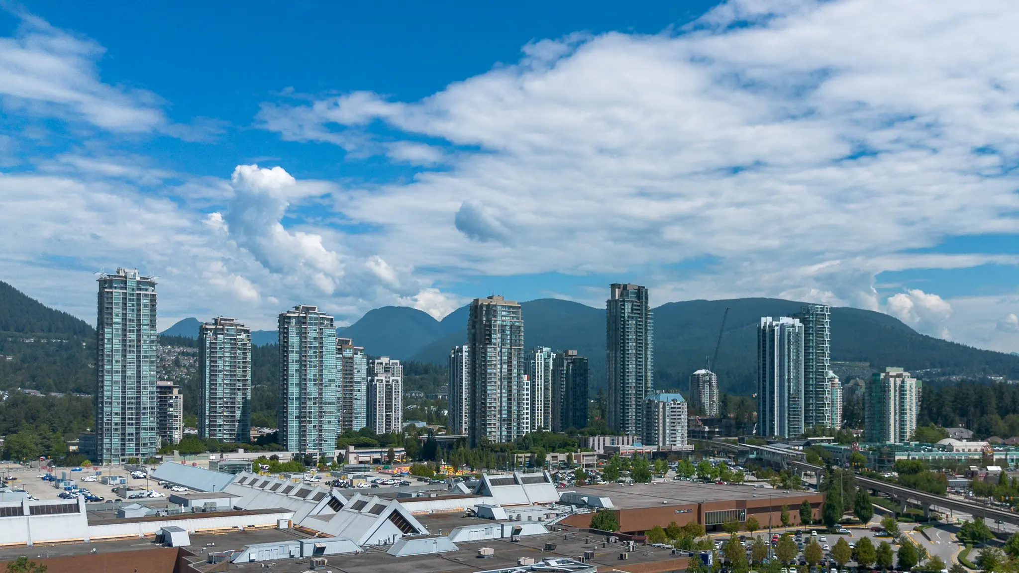 Coquitlam, British Columbia: The Town Centre area of Coquitlam, with Westwood Plateau on the left, and Burke Mountain on the right